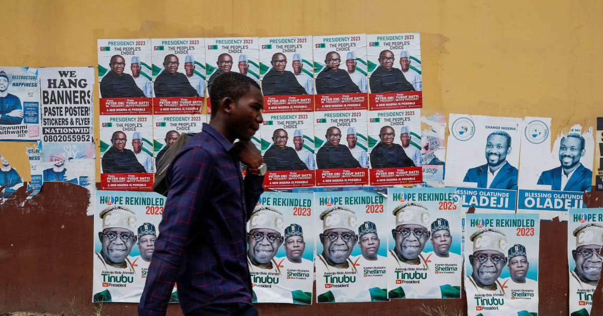 Campaign posters for Nigeria's 2027 general election lining a street wall